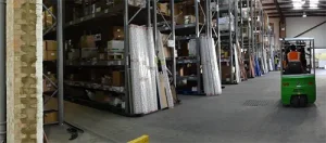 Inside the Embrass Peerless warehouse and forklift